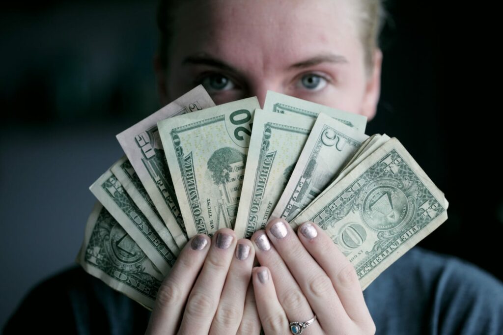 young man holding money