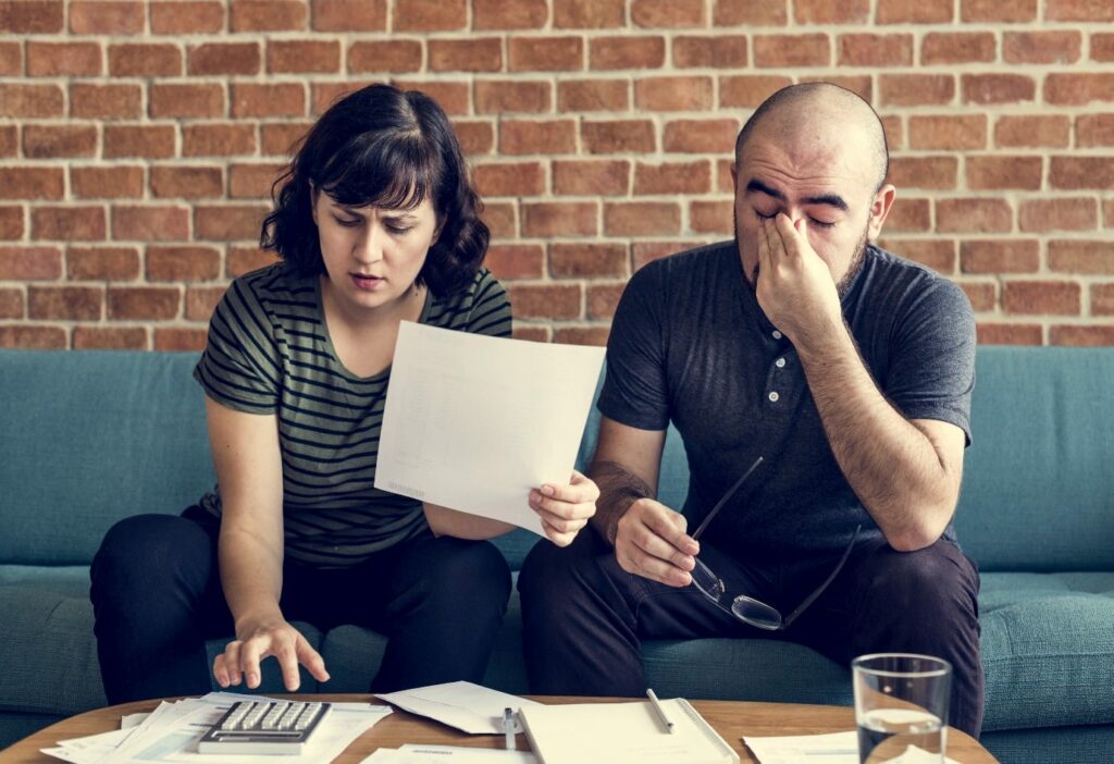 Couple Managing The Debt