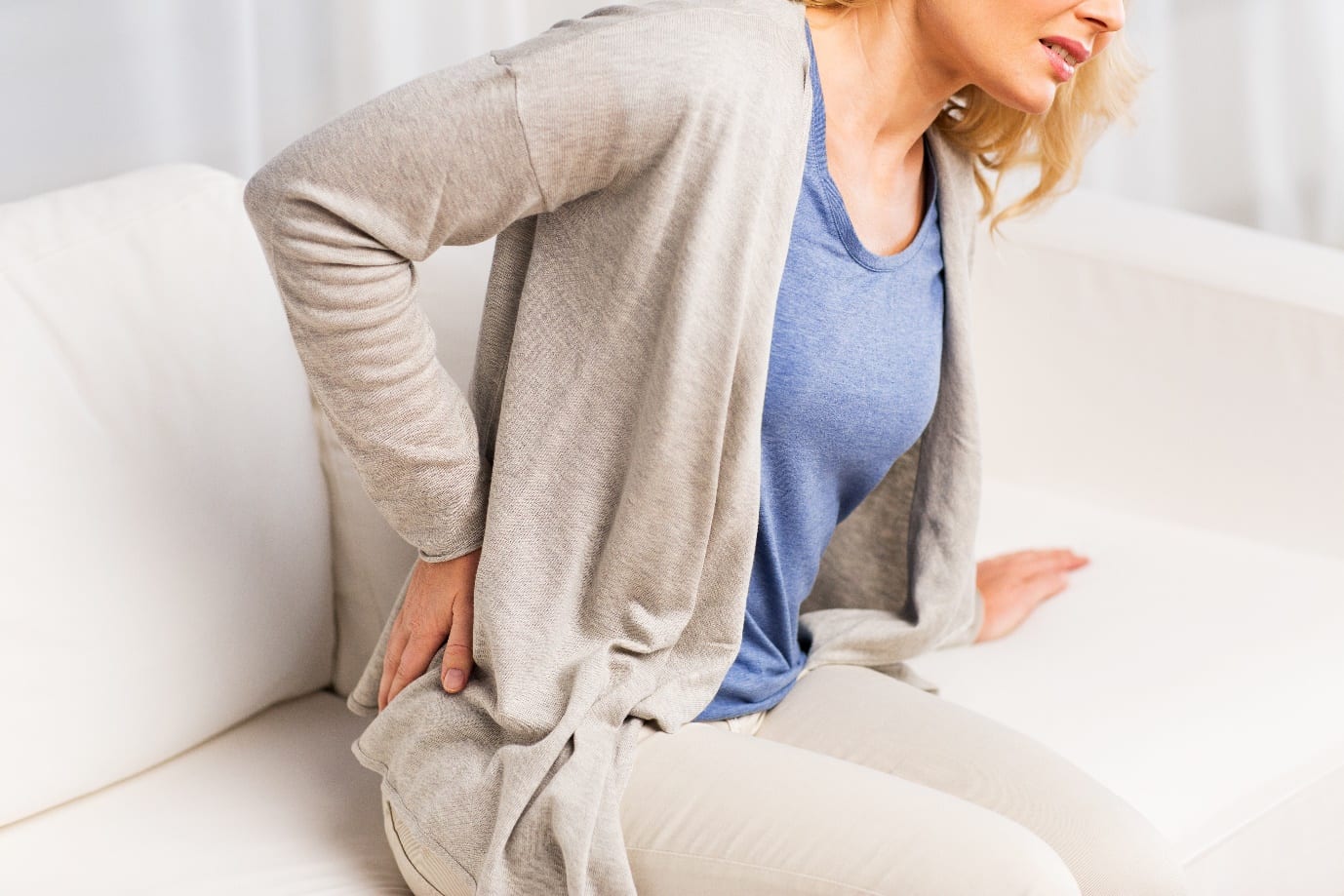 Woman Suffering From Backache At Home