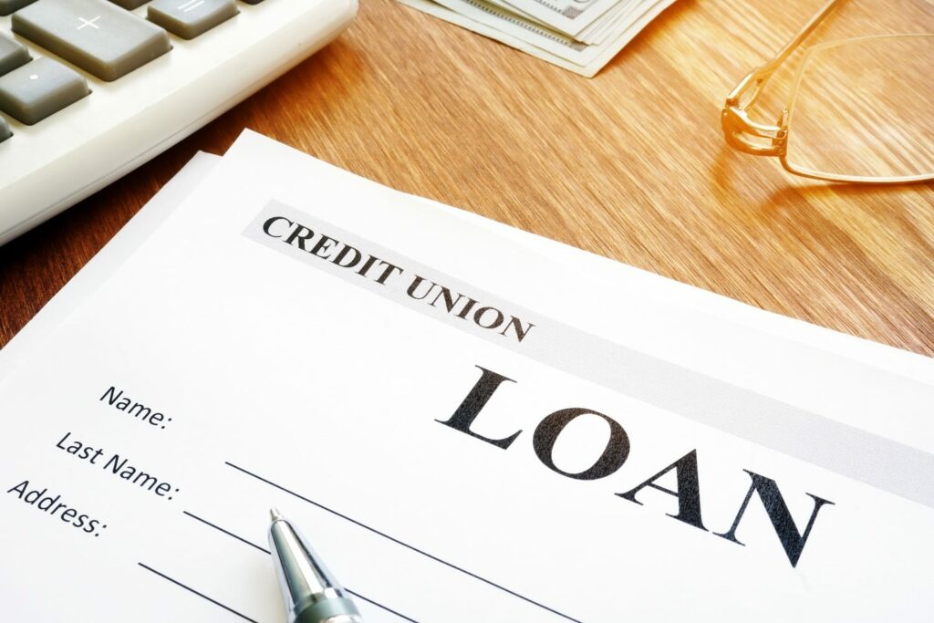 Credit union loan application form and pen