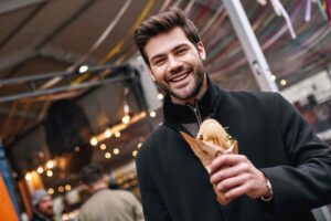 Man Holding Sub Sandwich