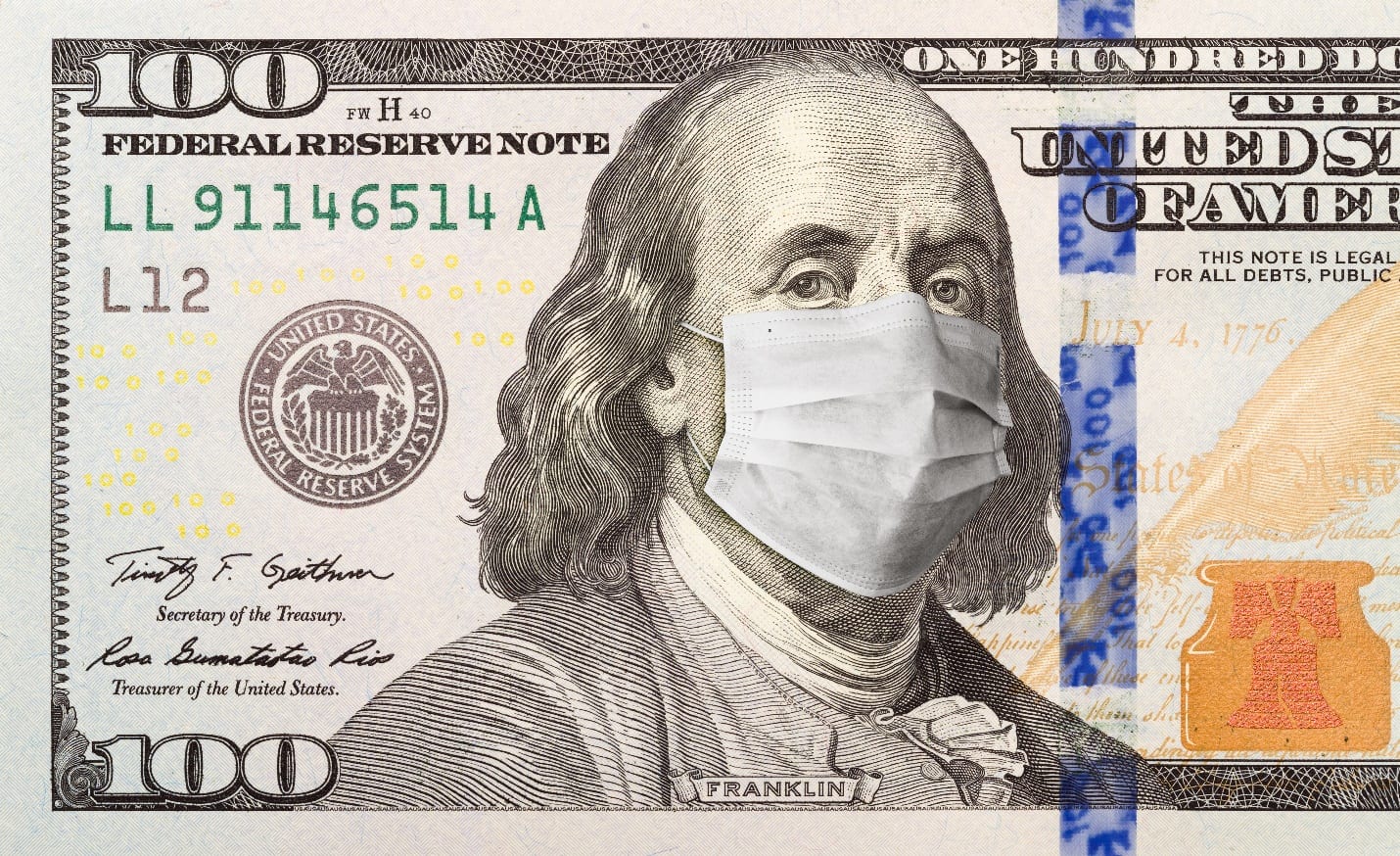 One Hundred Dollar Bill With Medical Face Mask on Benjamin Franklin