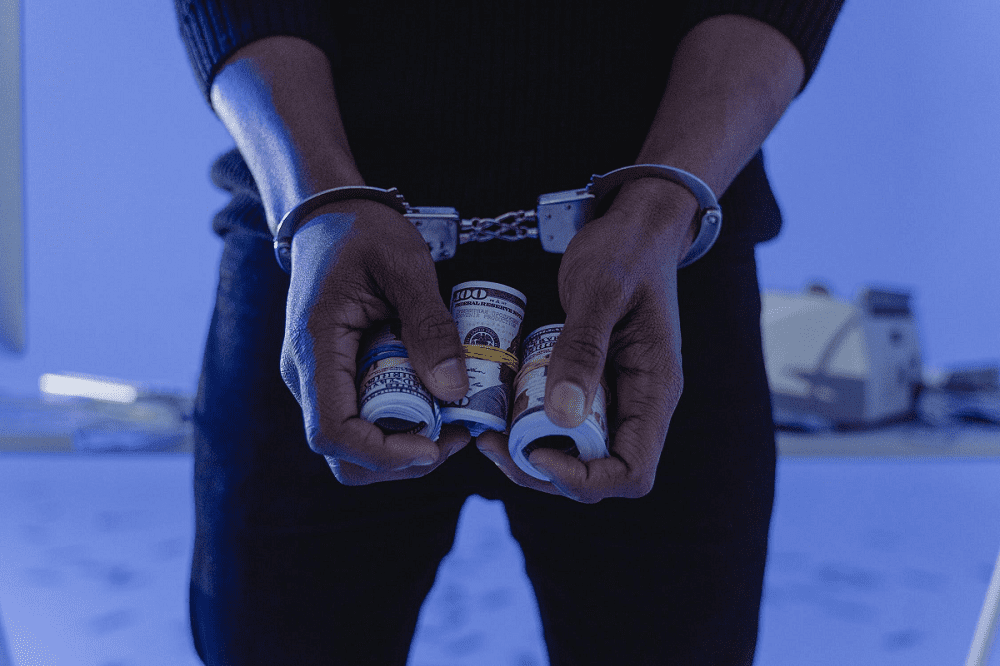 Handcuffs Hands Holding Money