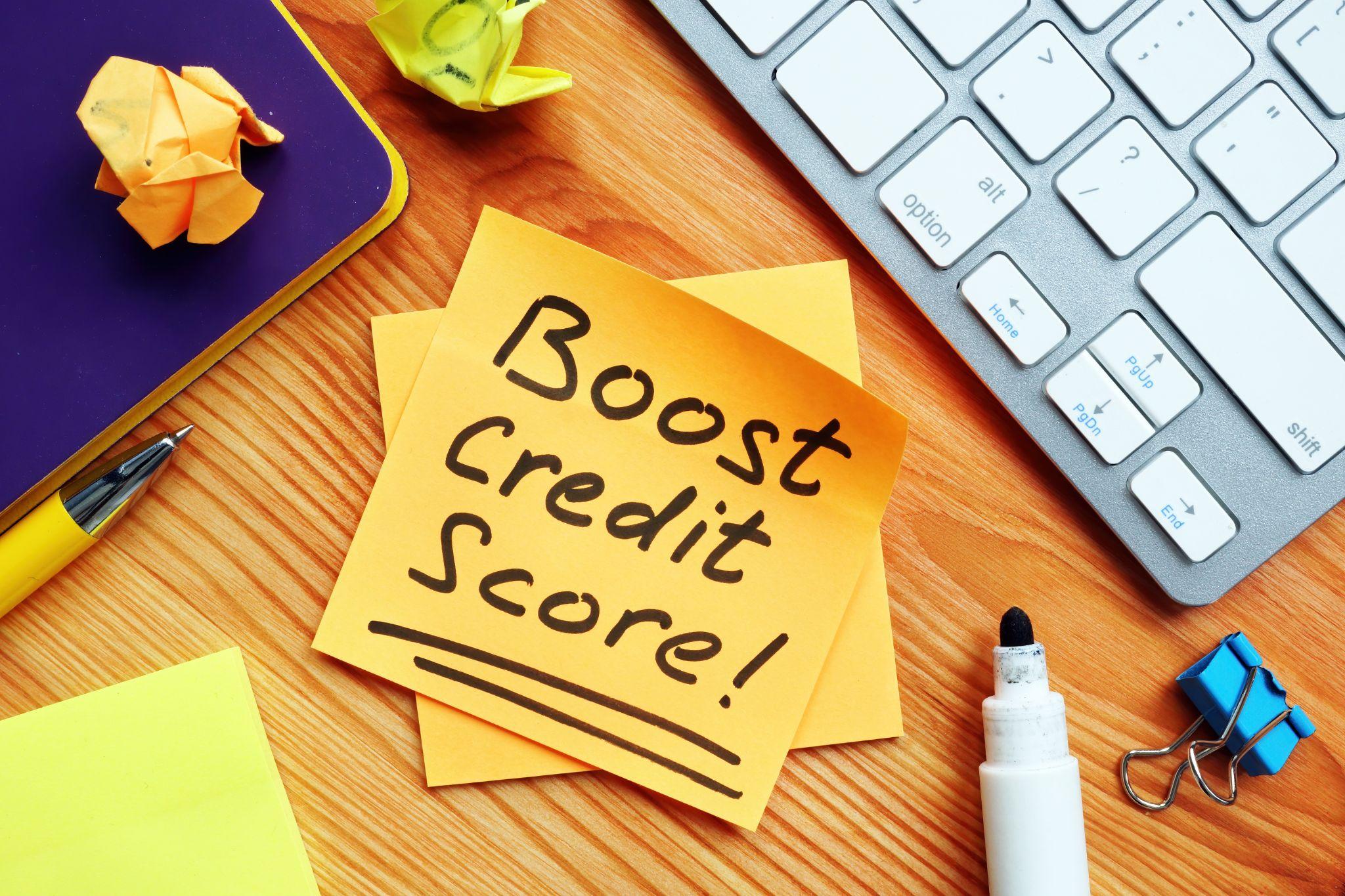 Boost credit score mark on the orange piece of paper.