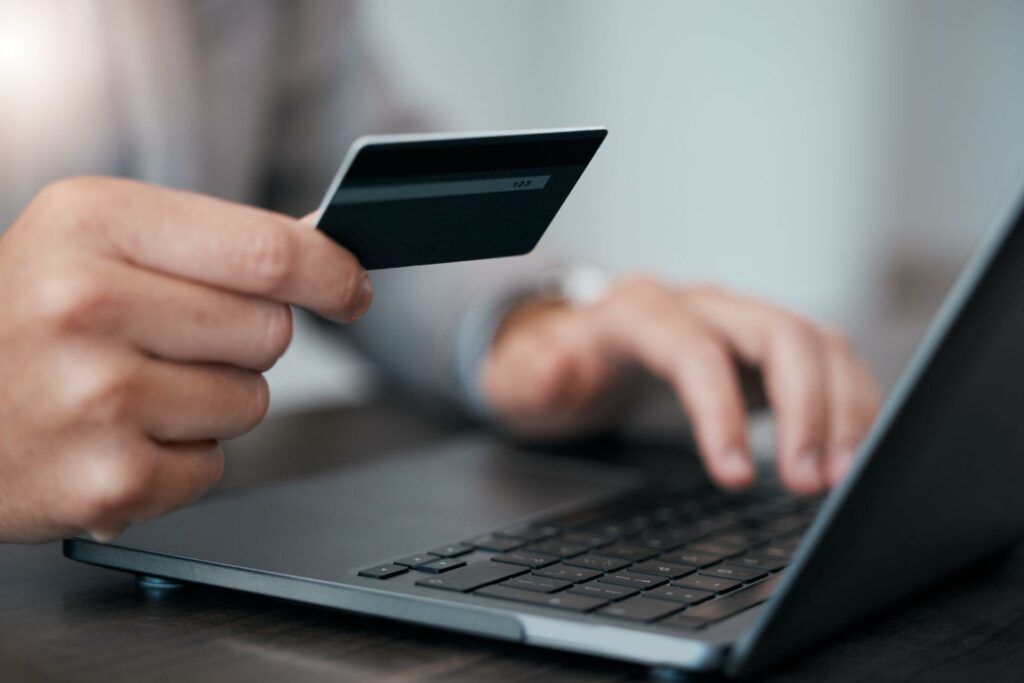 man using credit card for online banking