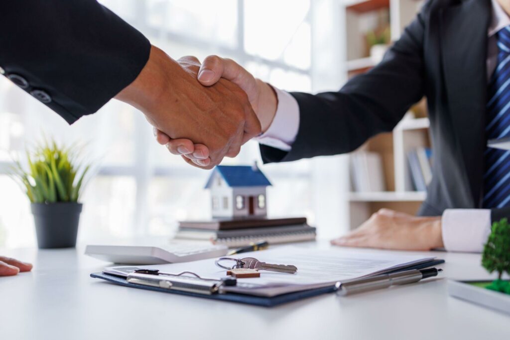 businessman shaking hands after mortage loan