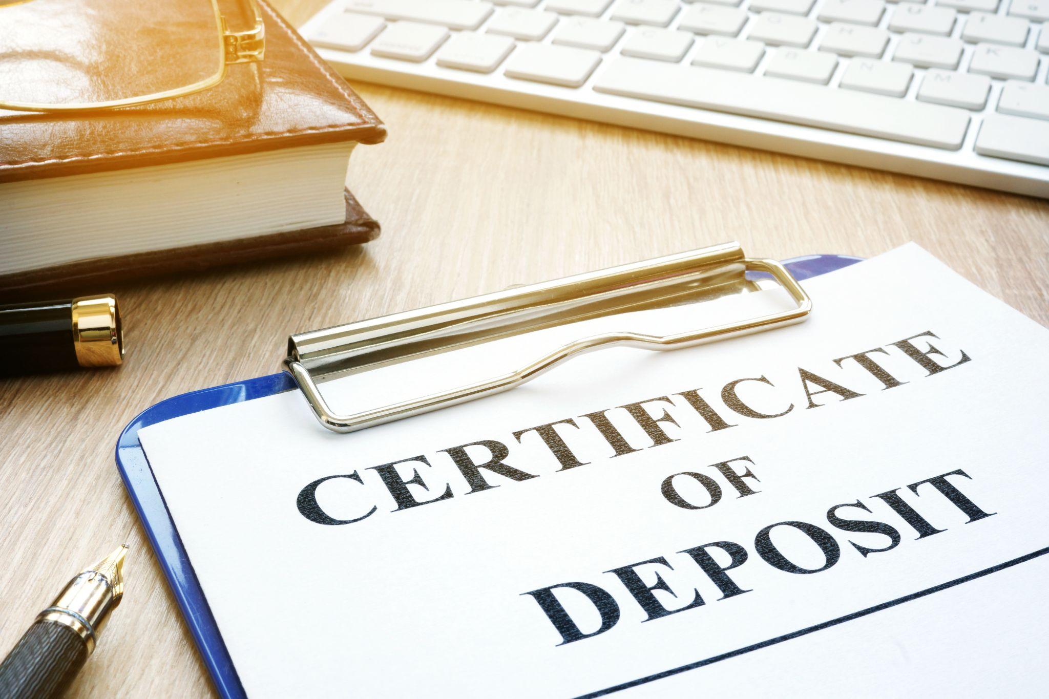 Certificate of deposit and pen on a desk