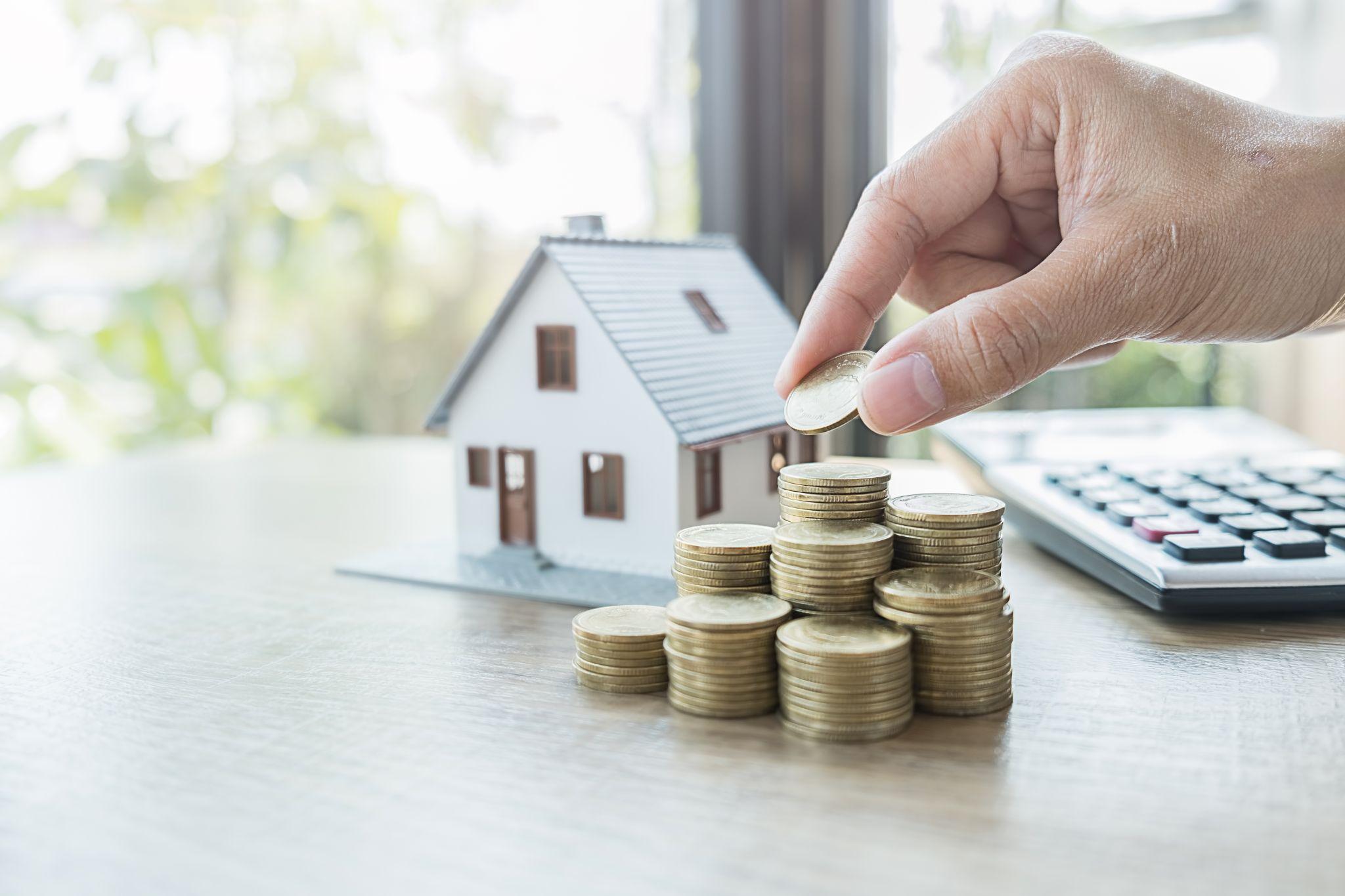 Miniature representation of a homeowner saving for a house